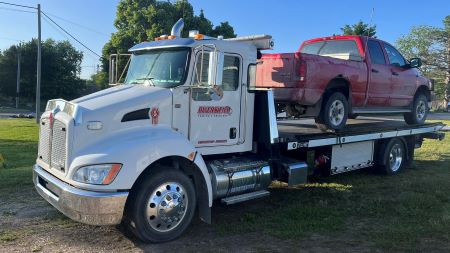 Flatbed Tow Truck Red Truck carrying pickup truck