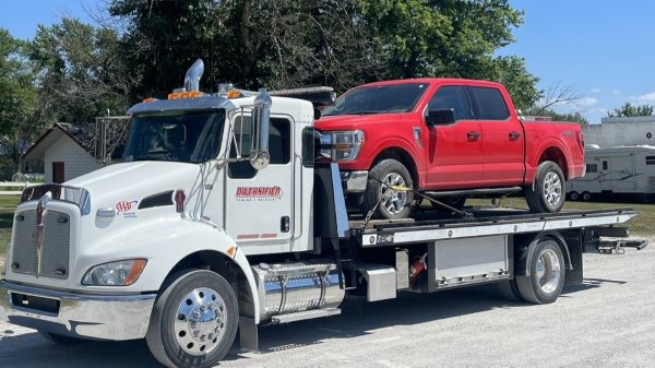 Red Pickup Truck on tow truck