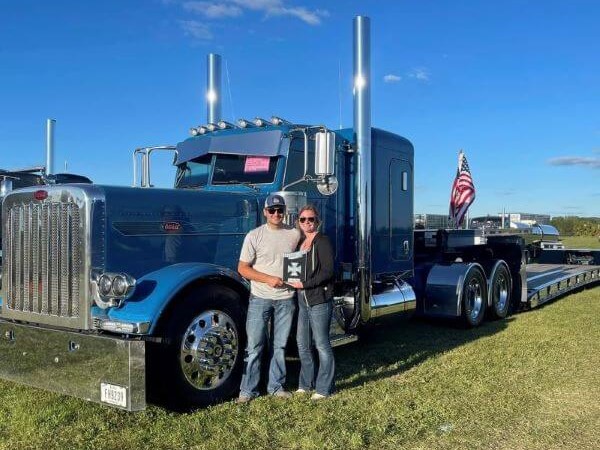 Jesse and Amber Giza in front of truck